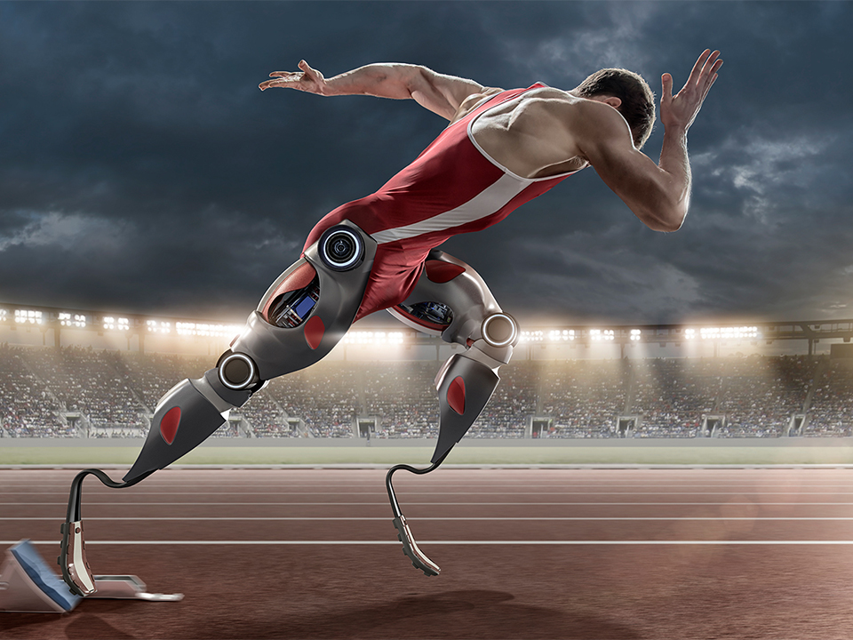 Physically Disabled Athlete Sprinting From Blocks With Artificial Robotic Legs